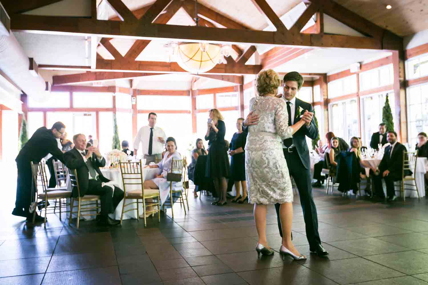 Groom dancing with mother at a Loeb Boathouse wedding in Central Park