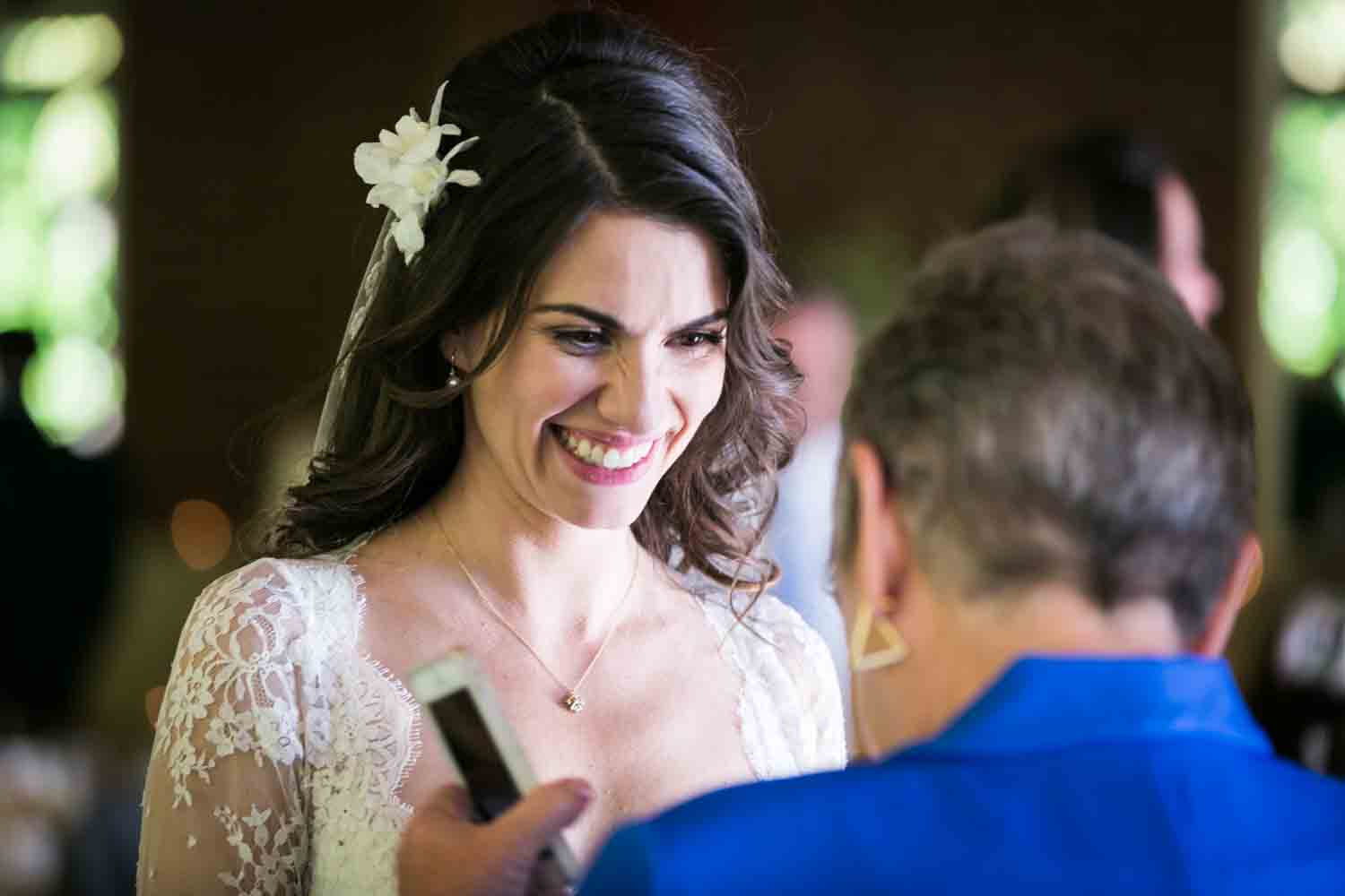 Bride smiling at guest at a Loeb Boathouse wedding in Central Park
