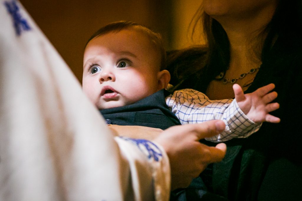 Light shining on baby by NYC Greek orthodox baptism photographer, Kelly Williams