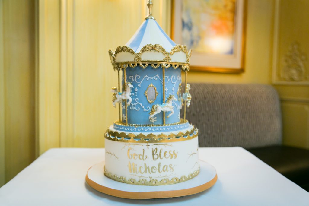 Carousel-themed cake for baptism reception at Arabelle Restaurant