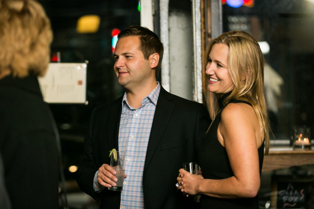 Two guests smiling for an article on rehearsal dinner tips