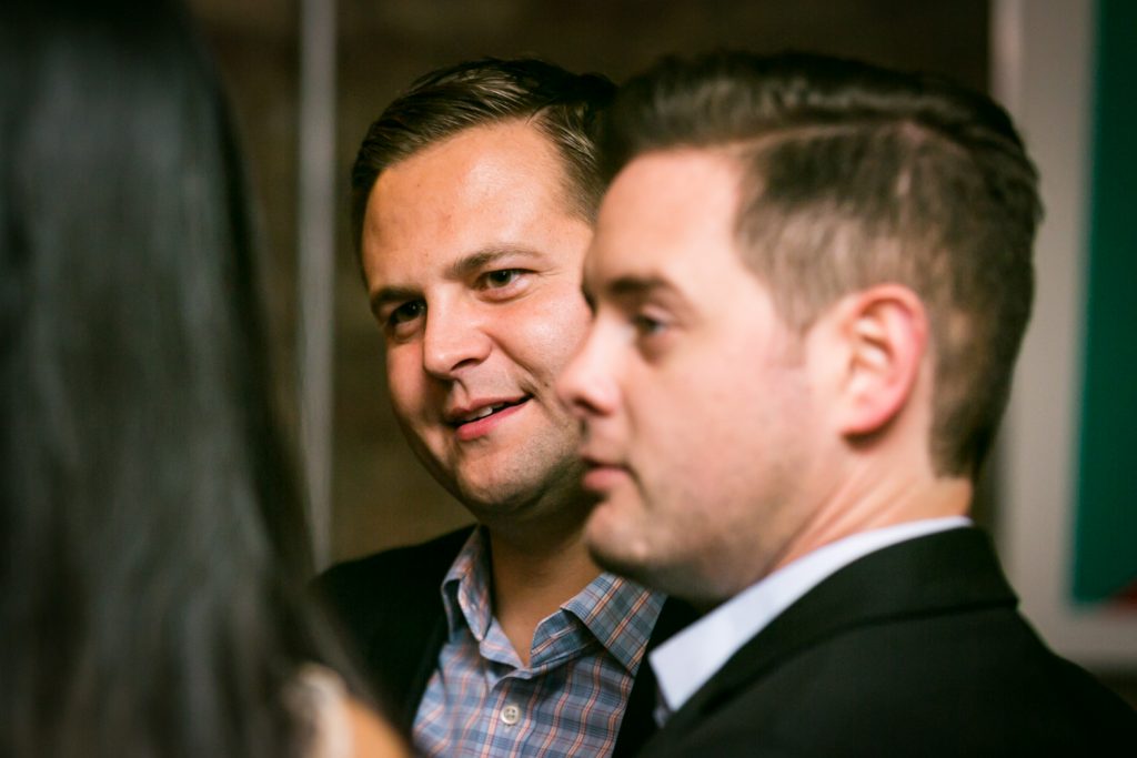 Two male guests at a rehearsal dinner for an article on rehearsal dinner tips