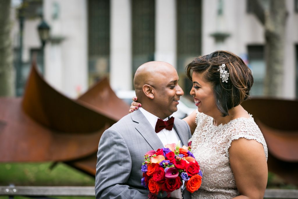 Bride and groom looking at each other after City Hall wedding for an article on wedding website tips