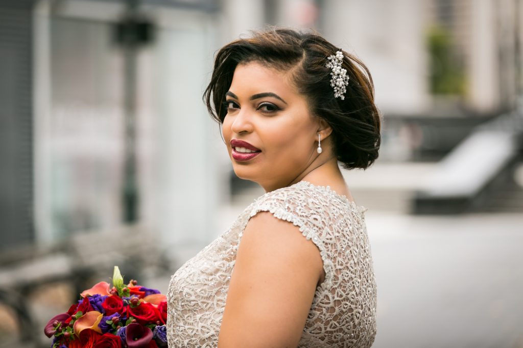 Portrait of bride looking over her shoulder for an article on wedding website tips