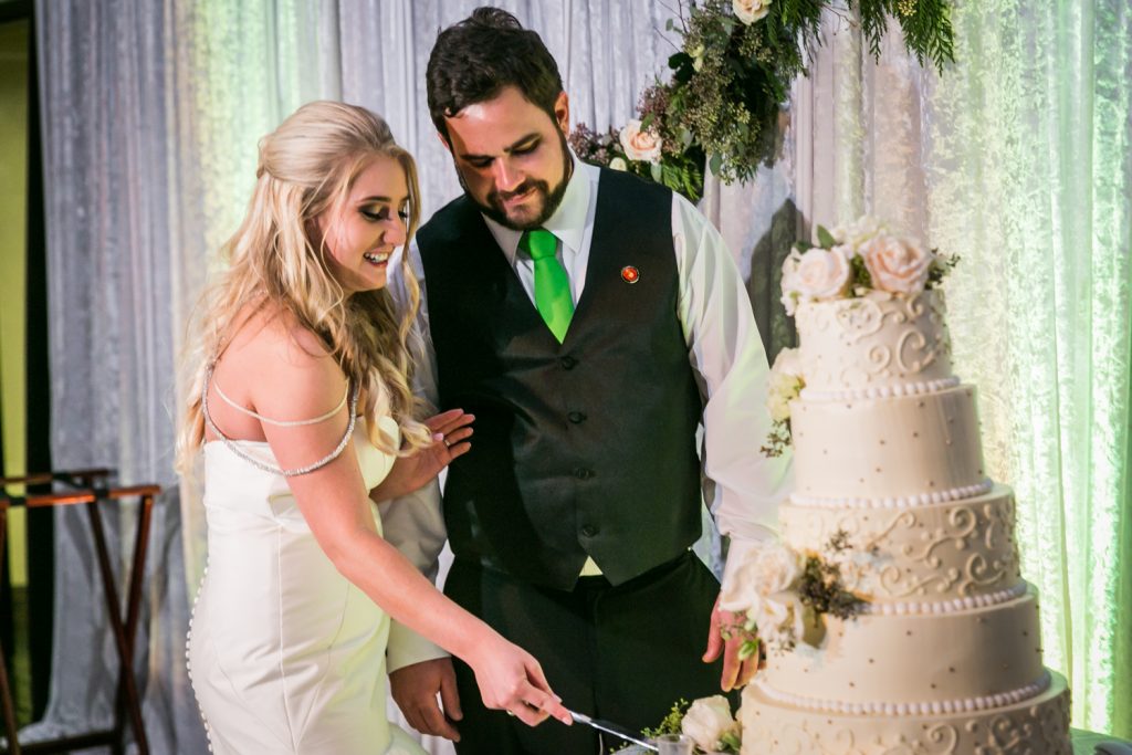 Bride and groom cutting cake at a West Palm Beach wedding