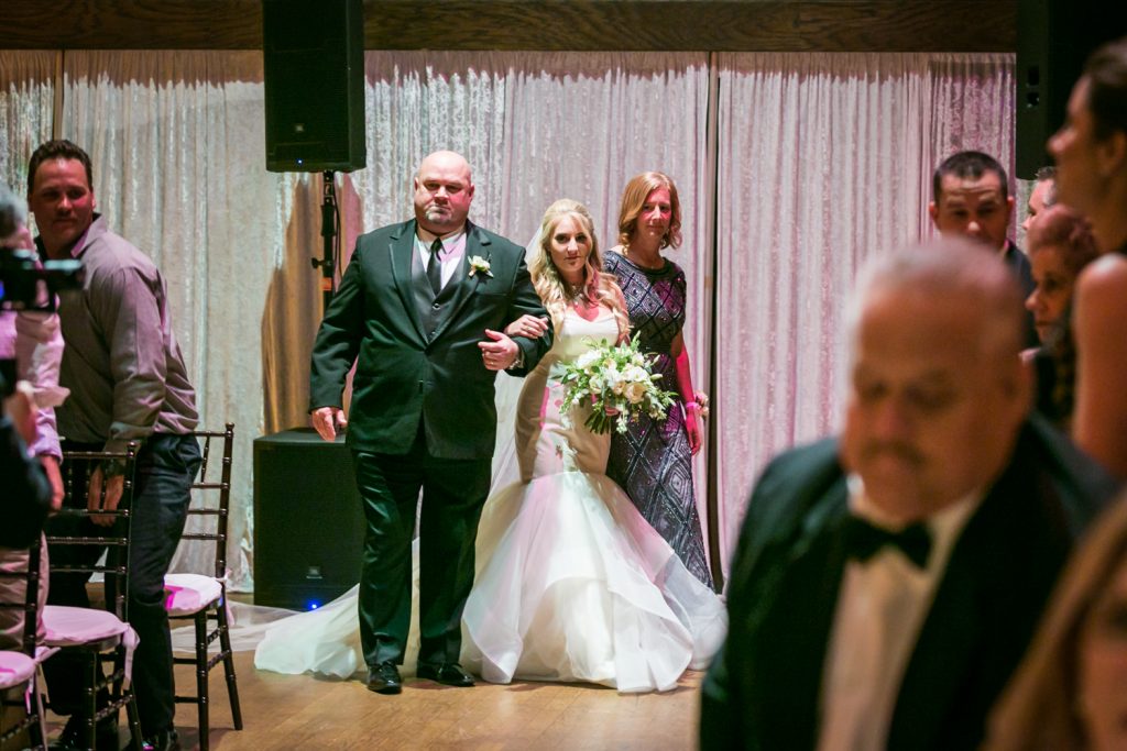Bride escorted by both parents at a West Palm Beach wedding