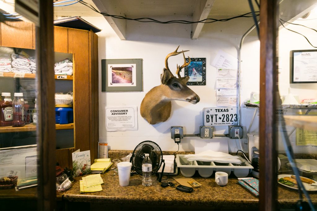 Yeehaw Junction photos of deer head over table in the Desert Inn Bar
