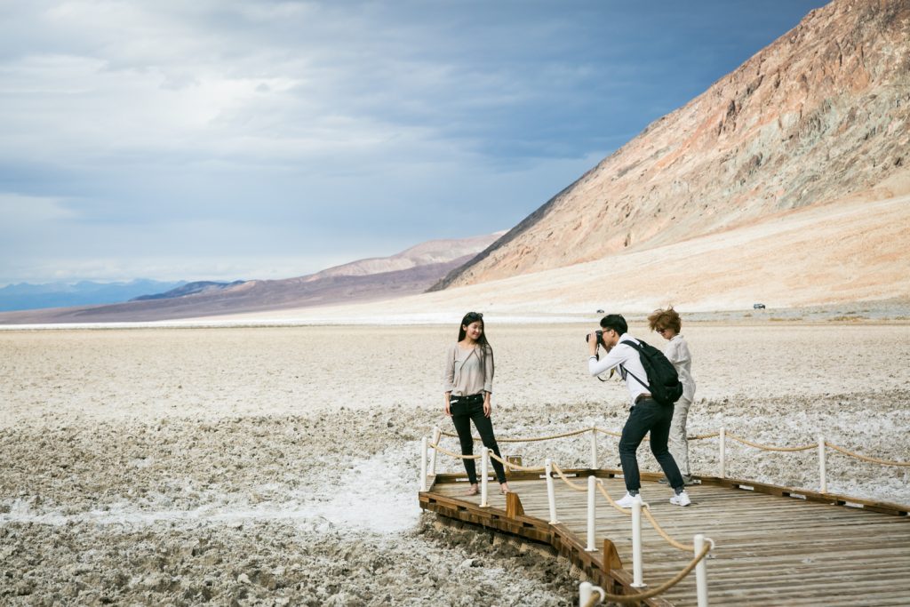 Tourists taking photos in Badwater in Death Valley National Park