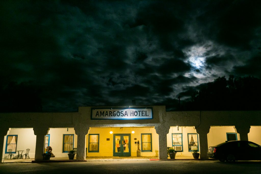 Entrance to Amargosa Opera House at night with moon overhead