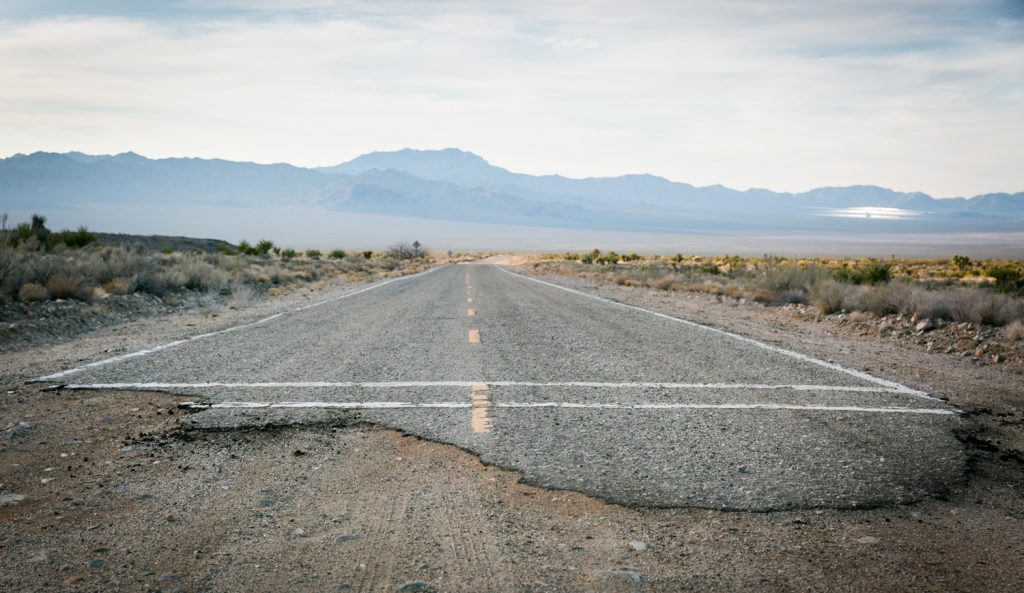 End of pavement on road in Mojave National Preserve