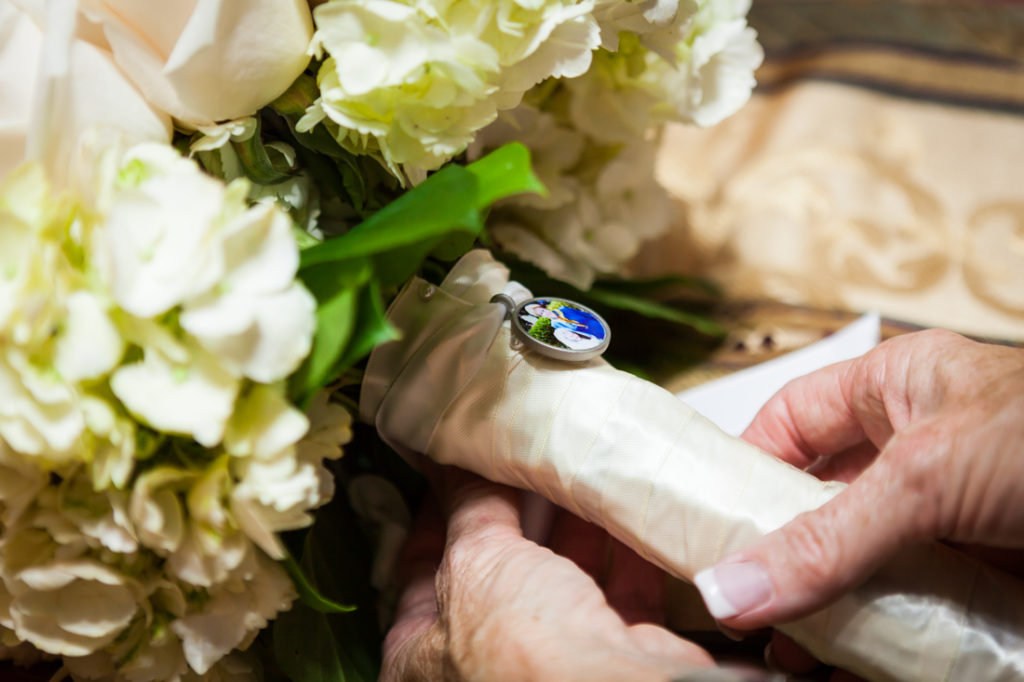 Photo locket on bouquet for an article on creative borrowed and blue wedding ideas