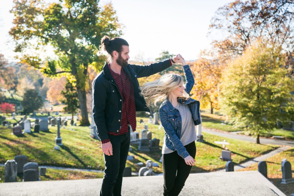 Green-Wood Cemetery engagement photos of man twirling girl