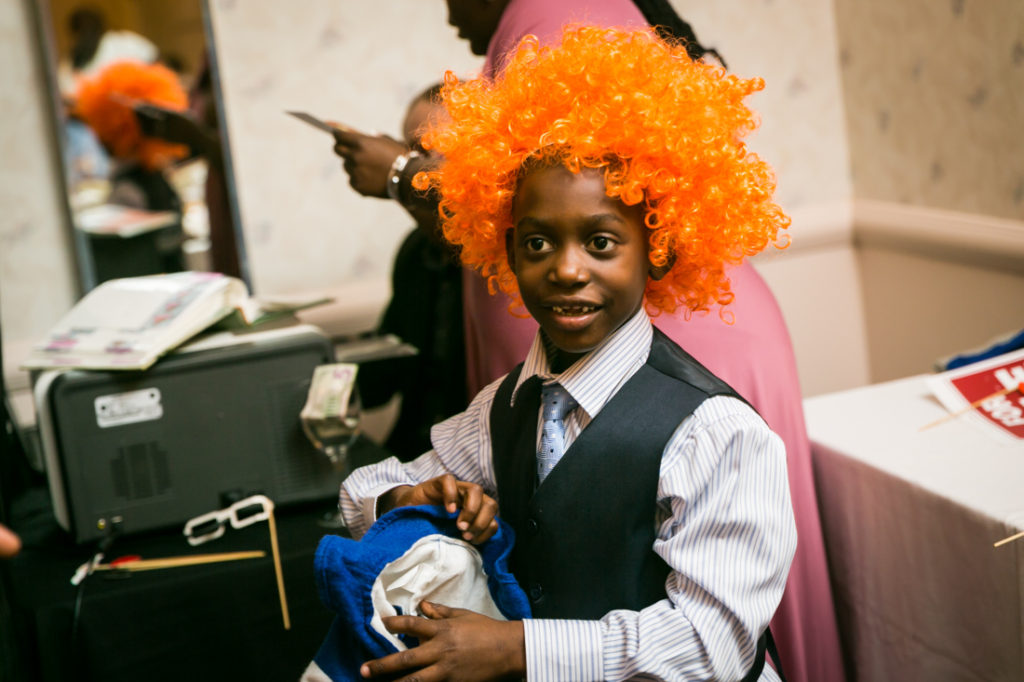 Boy in orange wig at a Glen Terrace wedding