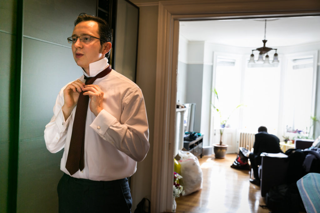 Groom getting ready for a Scottadito wedding in Brooklyn