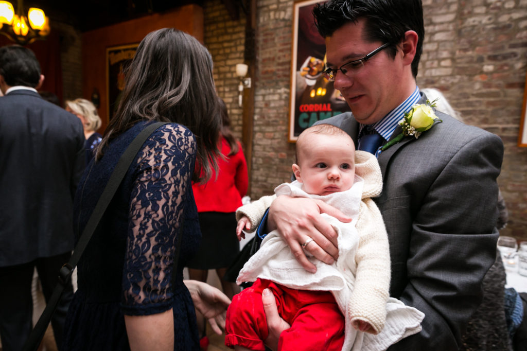 Guest and baby waiting for a Scottadito wedding