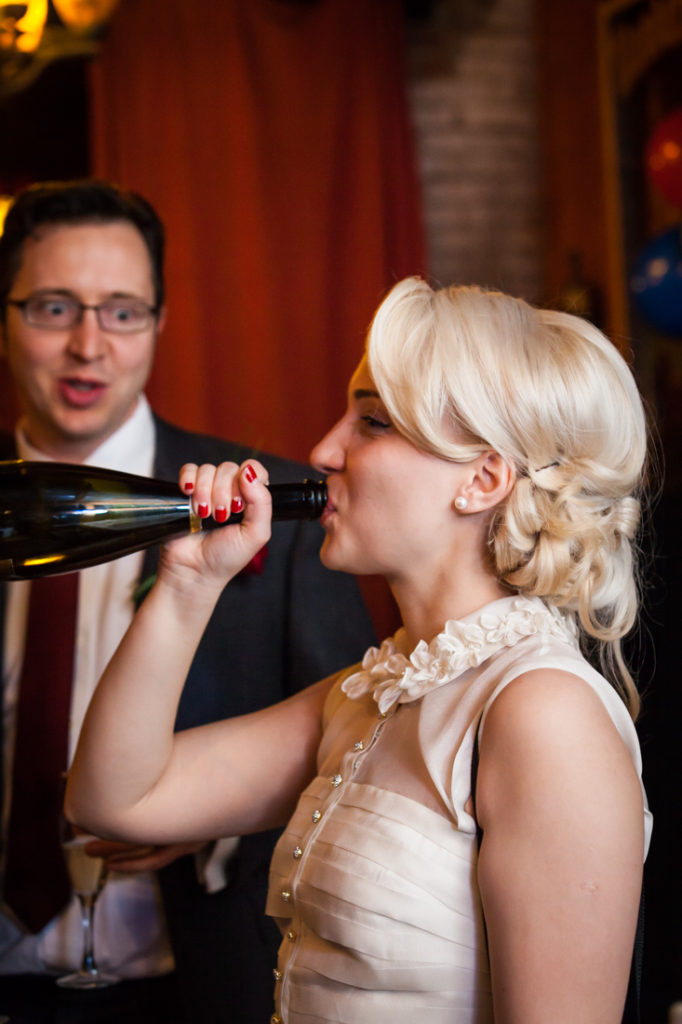 Bride drinking champagne at a Scottadito wedding
