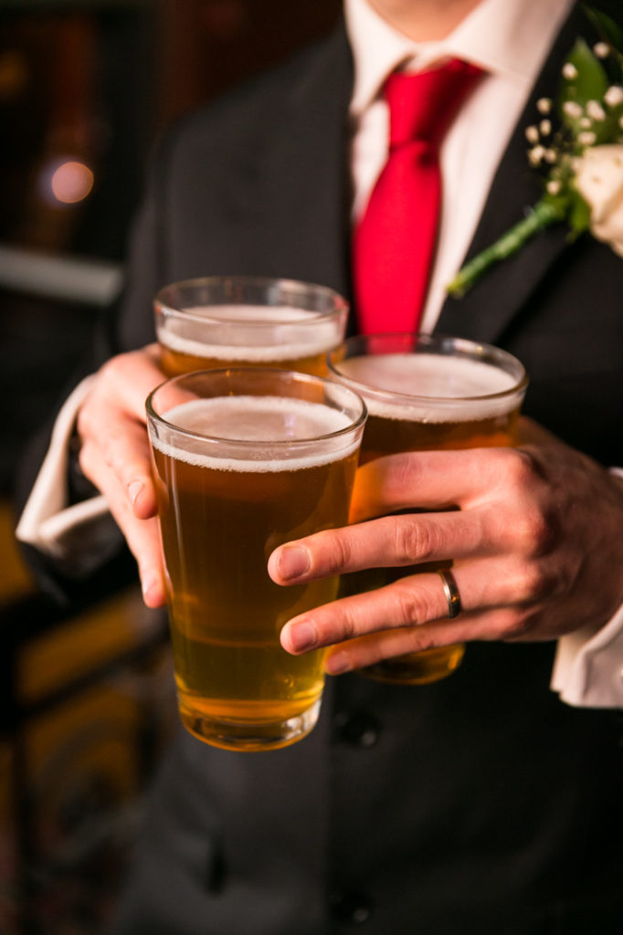 Wedding guest with beer at Union Hall in Brooklyn