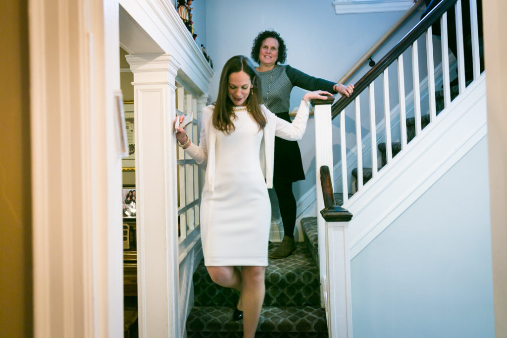 Bride descending a staircase for an article on the top fears about wedding photographers