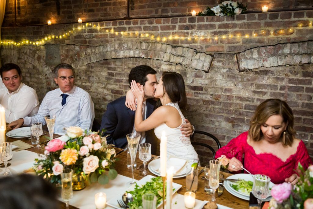 Bride and groom kissing at a Wythe Hotel wedding