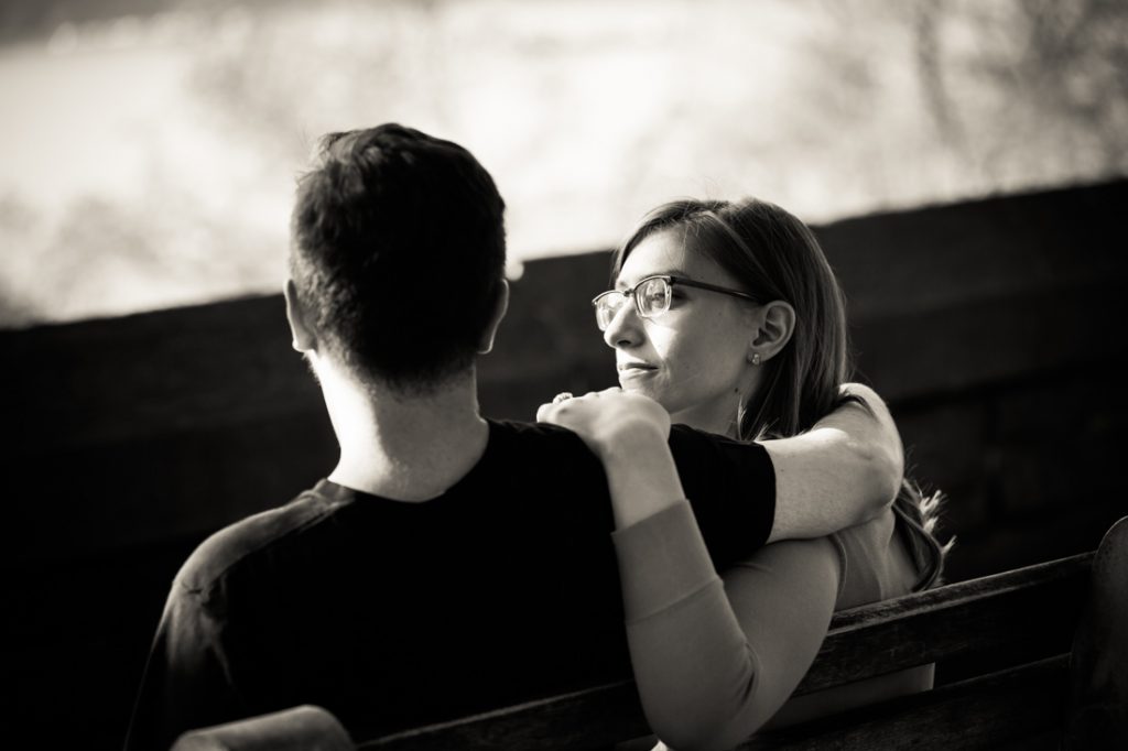 Couple on bench at a Fort Tryon Park engagement portrait