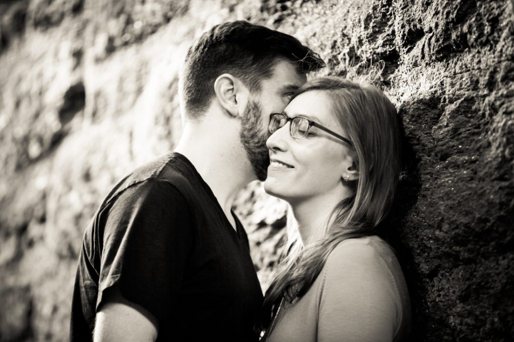 Kissing couple at a Fort Tryon Park engagement portrait