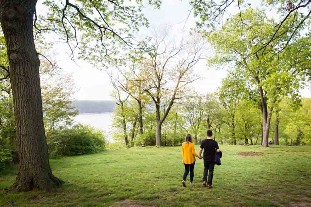 Couple walking at a Fort Tryon Park engagement portrait