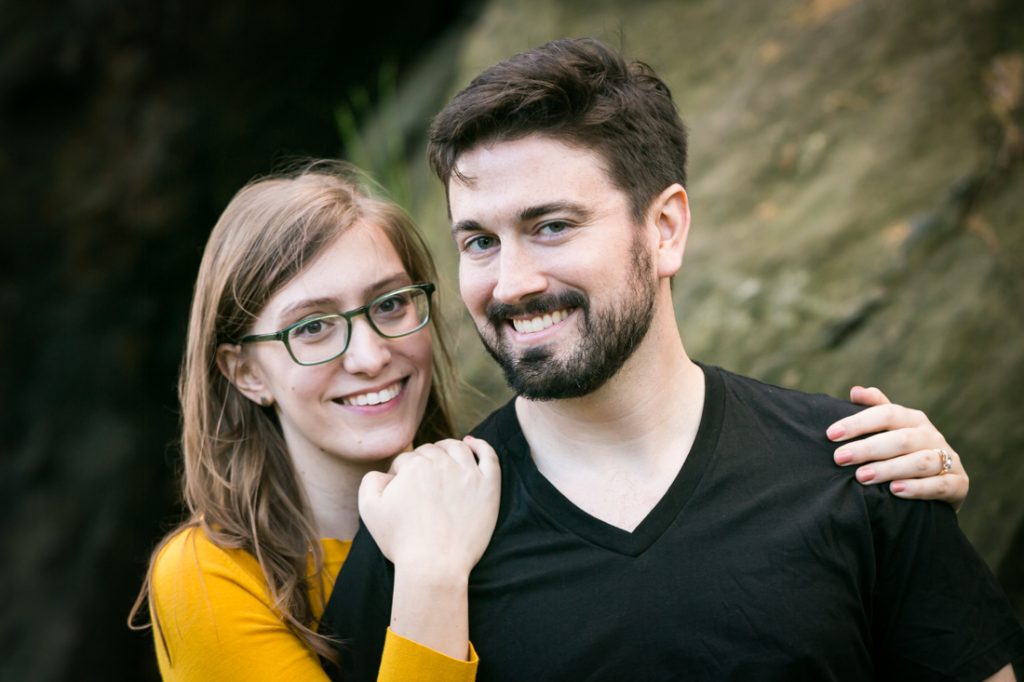 Smiling couple at a Fort Tryon Park engagement portrait