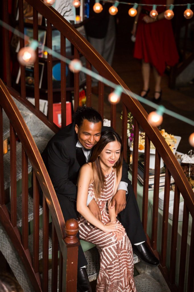 Couple sitting on staircase during a Housing Works Bookstore wedding