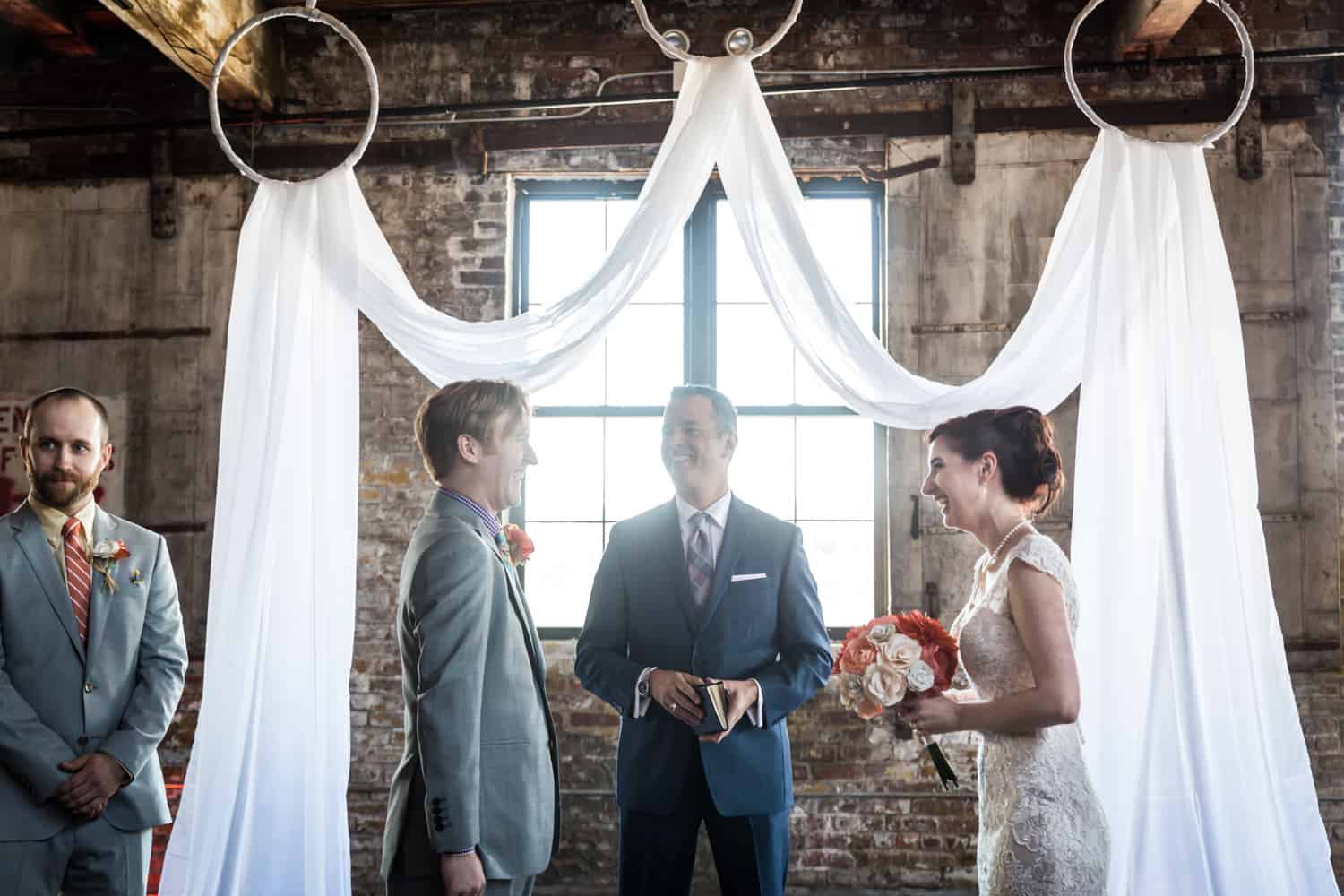 Bride and groom exchanging vows at a Greenpoint Loft wedding