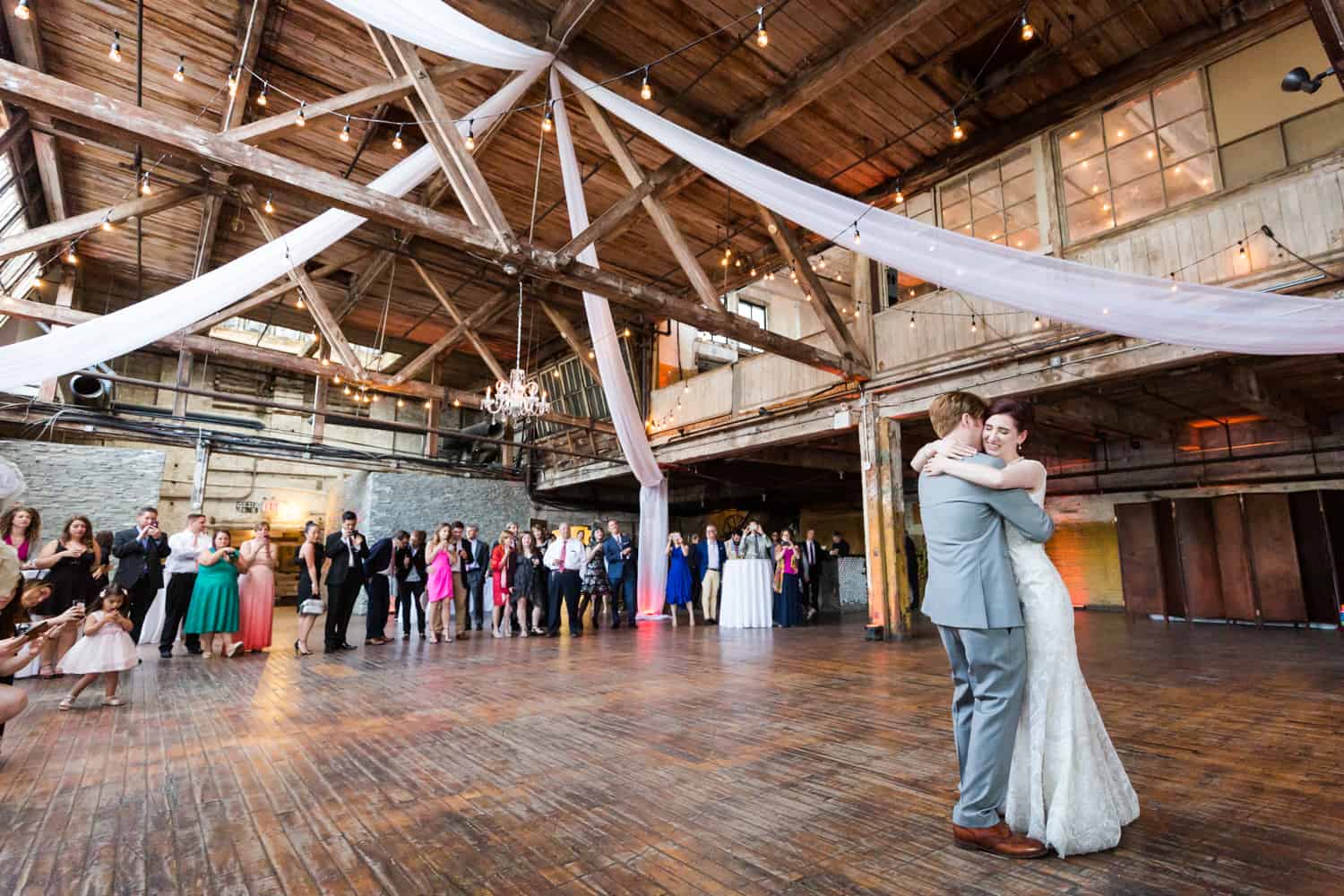 Wide shot of bride and groom during first dance at a Greenpoint Loft wedding