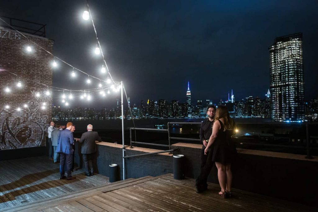 Nighttime on the roof of the Greenpoint Loft with view of NYC skyline