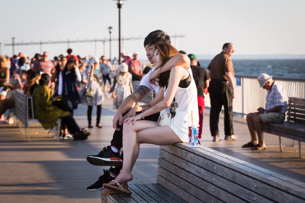 Lovers on a bench at the Coney Island pier