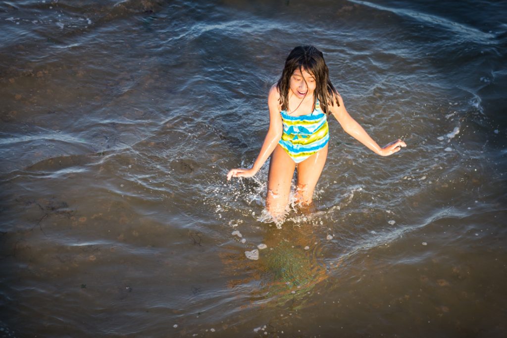 Girl in the ocean at Coney Island