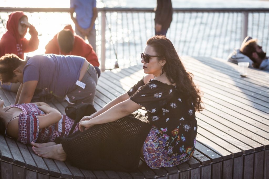 Woman in sunglasses on the Coney Island pier