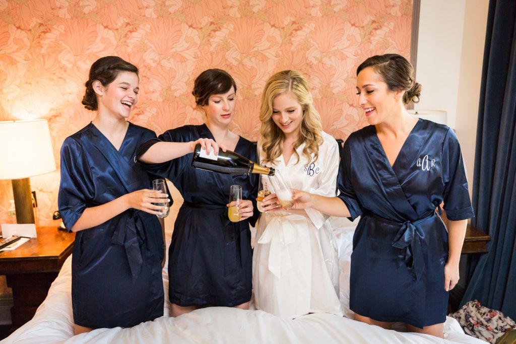 Bride and bridesmaids toasting before a Gallow Green wedding