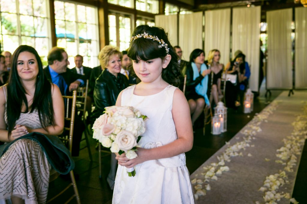 Flower girl walking down aisle for an article on wedding officiant tips