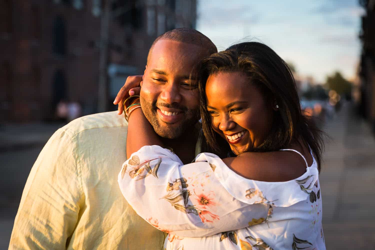 African American couple hugging for an article on creative engagement photo shoot ideas