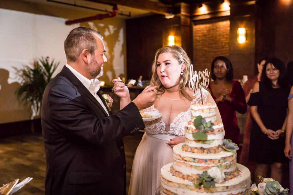 Cake cutting at a 26 Bridge wedding
