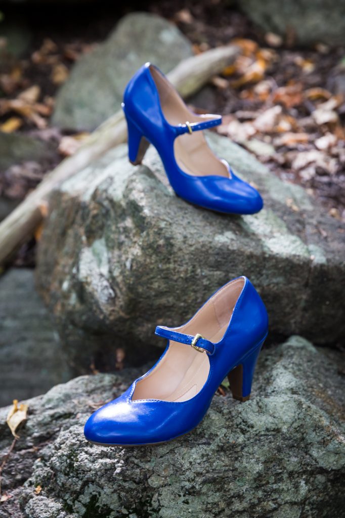 Blue wedding shoes on a rock at a Bear Mountain Inn wedding
