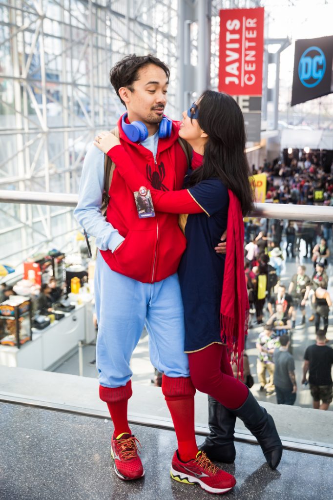 Couple dressed as Spiderman and Supergirl for a Comic Con engagement shoot