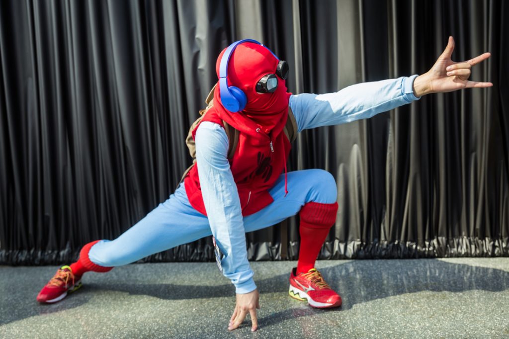 Couple dressed as Spiderman and Supergirl for a Comic Con engagement shoot