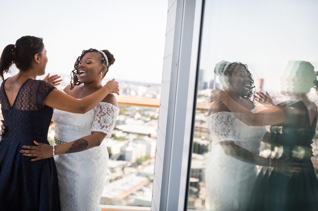 Bride and guest laughing for an article on elopement tips