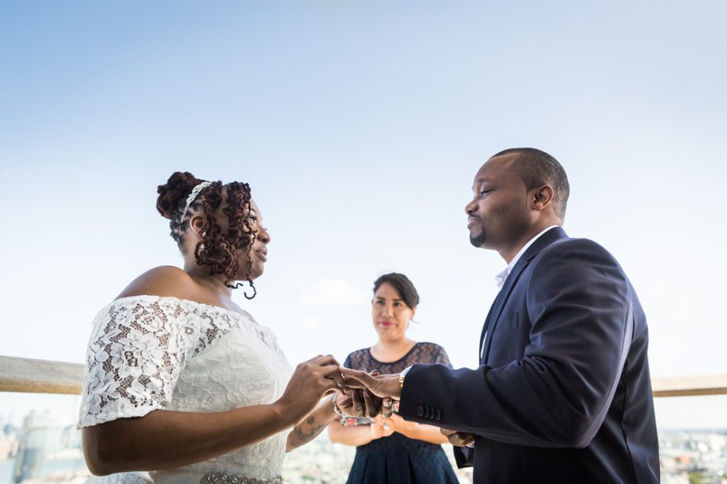 Bride and groom exchanging rings for an article on elopement tips