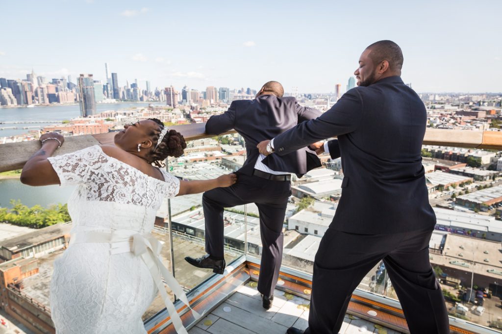 Grooml trying to jump over the ledge for an article on elopement tips
