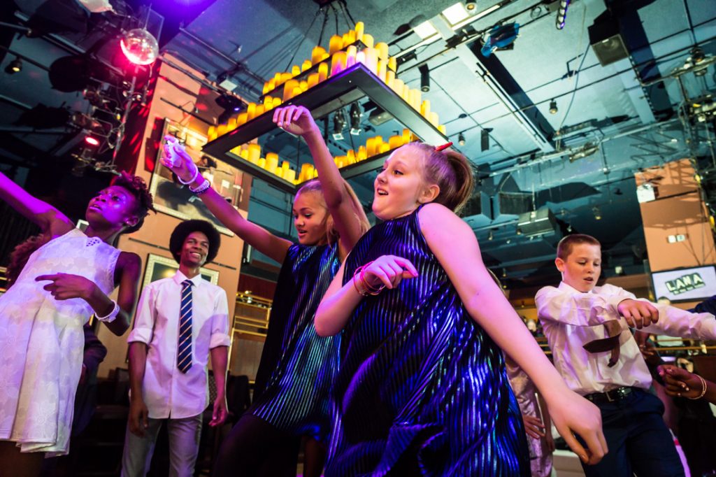 Kids dancing at a bat mitzvah for an article on ‘How to Find a Venue’