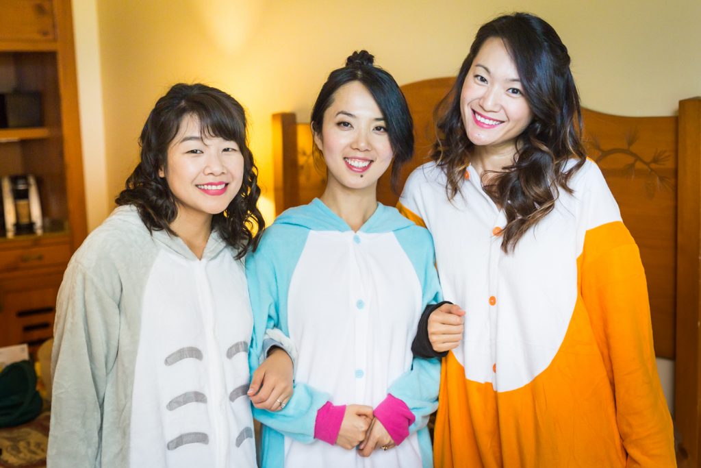 Bride and two bridesmaids wearing animal-themed onesies at a Bear Mountain Inn wedding