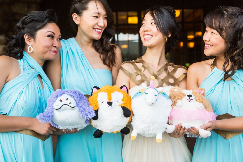 Bride and bridesmaids holding stuffed animals as bouquets at a Bear Mountain Inn wedding