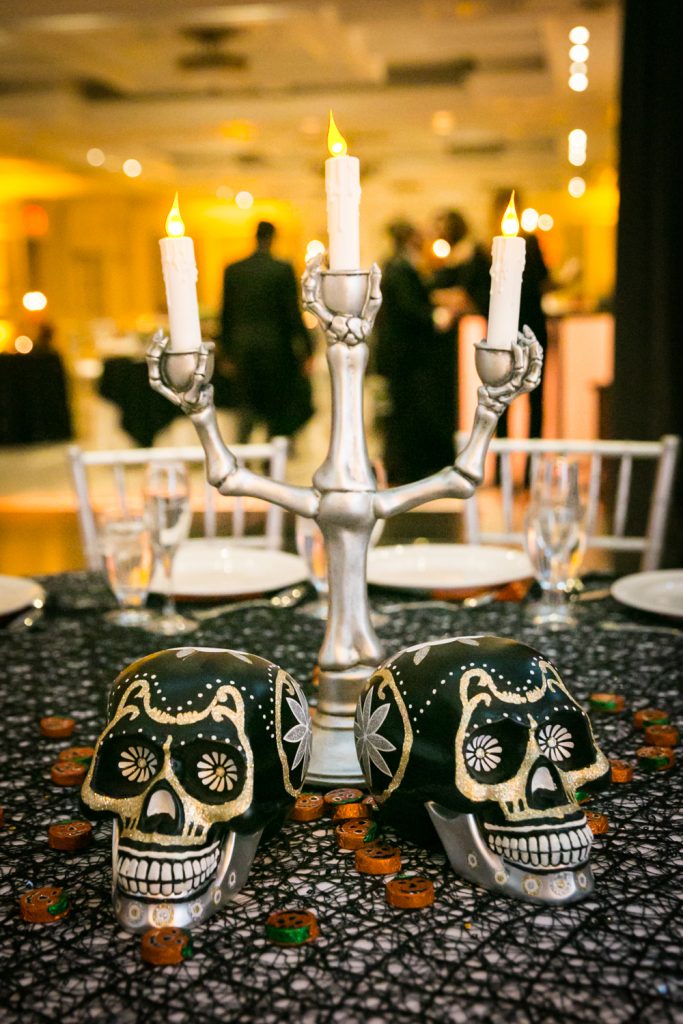 Candleabra with two black and gold skulls