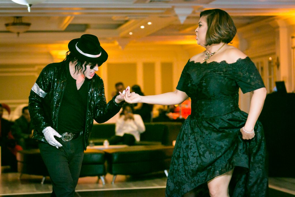 Bride dancing with Michael Jackson impersonator for an article on how to plan a Halloween wedding
