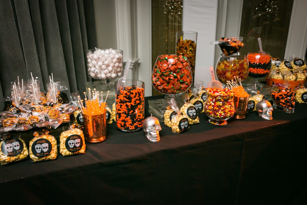 Buffet of Halloween candy for a wedding reception